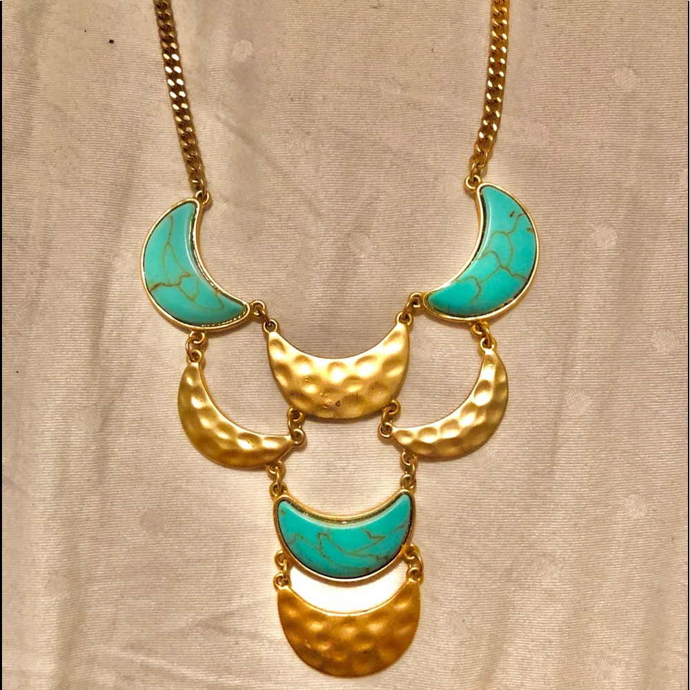 Gold and turquoise statement necklace.